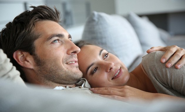 happy couple on the bed